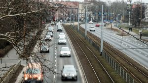 A city street filled with lots of traffic